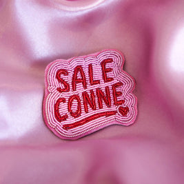 Broche Sale conne
